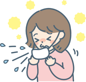 花粉症の女性がくしゃみをしているところ