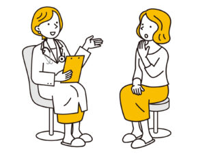 病状の説明をする医師と受ける患者